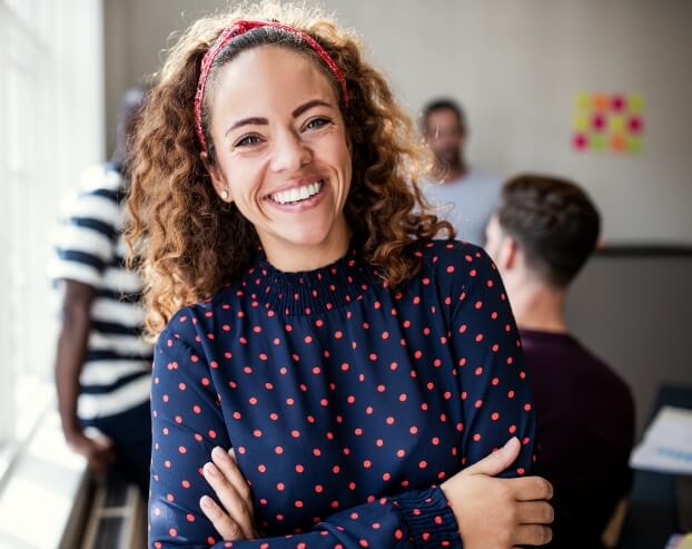 Young woman sharing healthy smile after visiting the dentist