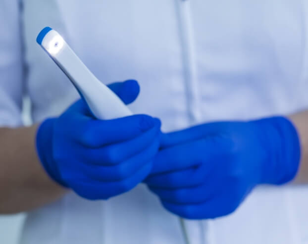 Dentist holding an intraoral camera