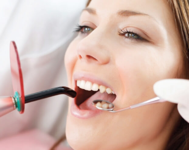 Dentist using laser assisted cavity detection system