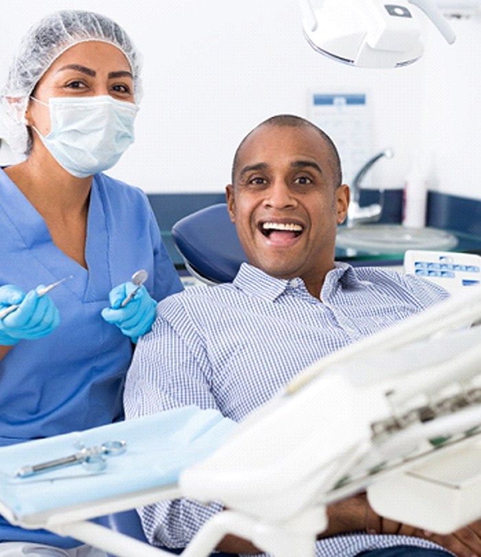 Happy patient visiting a BlueCross BlueShield dentist in Boston