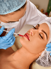 Woman receiving dermal filler treatment