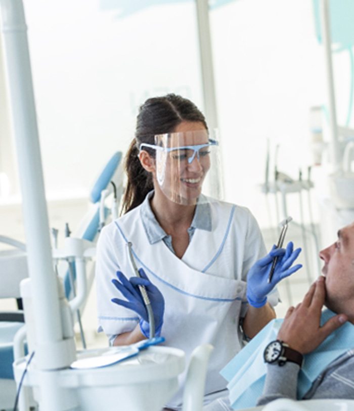 A man getting a dental bridge in downtown Boston