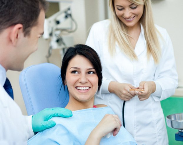 A woman receiving a dental bridge in downtown Boston