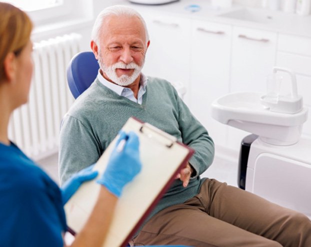 Dentist talking to a patient