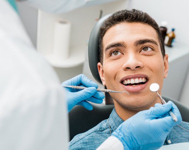 Someone sitting in a dental chair 