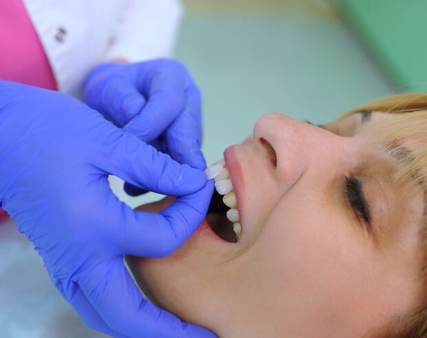 Patient receiving dental bonding treatment