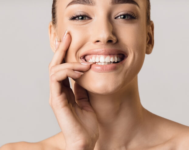 Patient with beautiful smile after gum recontouring