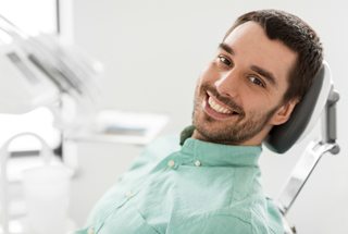 Man smiling in dental chair