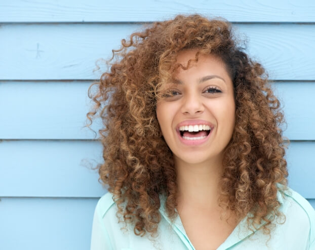 Woman with beautiful smile after dental bonding