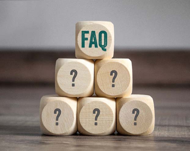 Wooden blocks with question marks stacked in pyramid