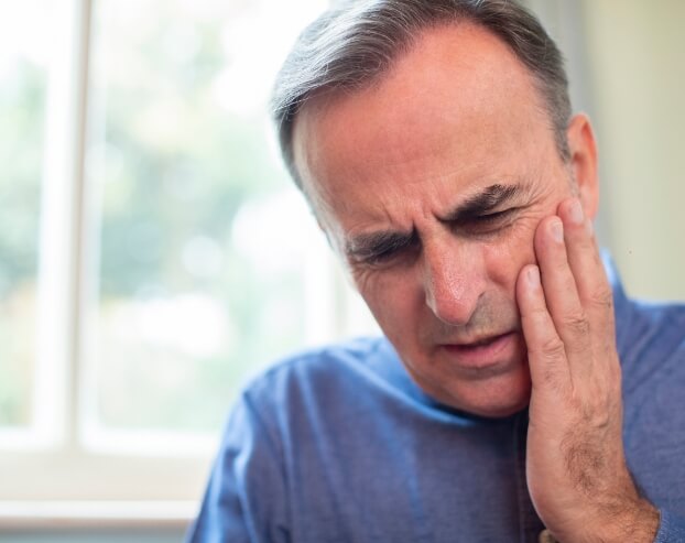 Man in pain before tooth extraction