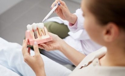 A woman receiving a dental bridge in downtown Boston