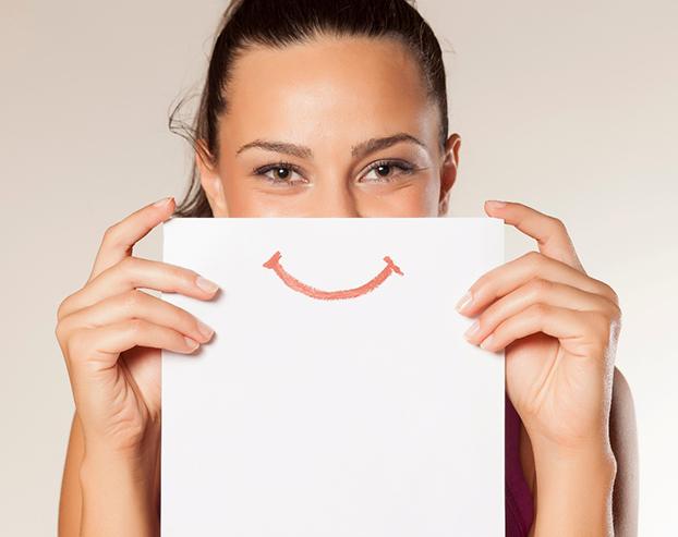 woman hiding smile before Invisalign in Boston