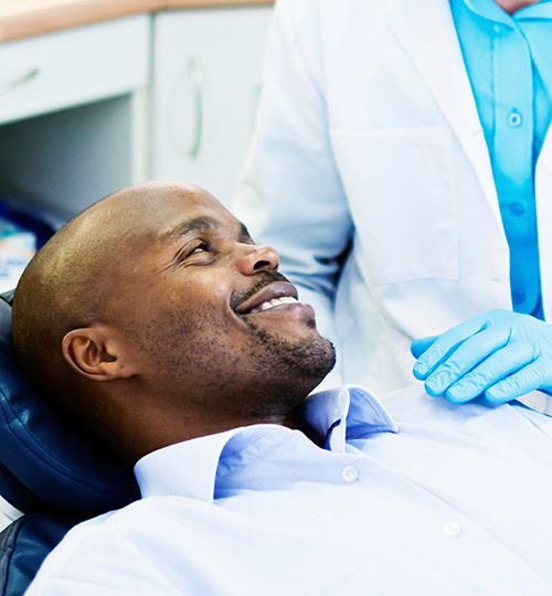 Smiling man in dental chair