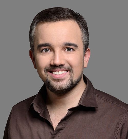 Headshot of man with attractive smile after Invisalign