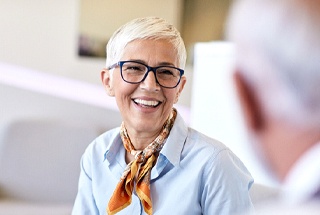 Senior woman smiling during meeting