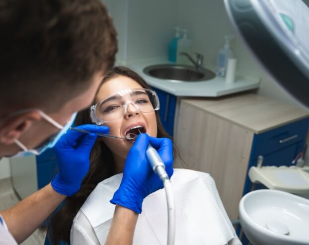 Dentist performing root canal therapy