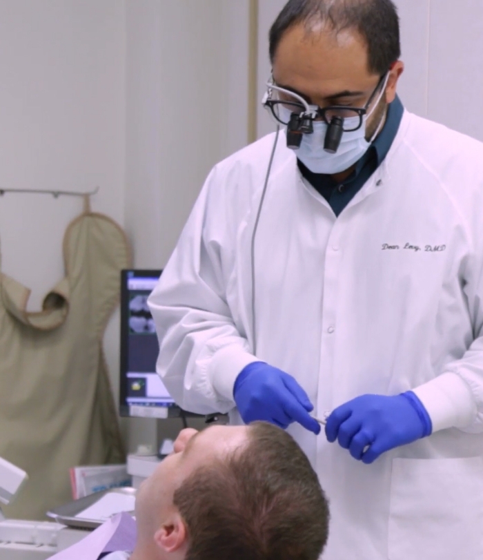 Dentist and patient discussing options for dental services