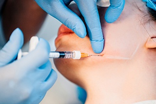 patient receiving a BOTOX injection for TMJ therapy in Downtown Boston