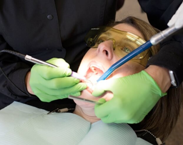 Dental patient receiving porcelain veneers
