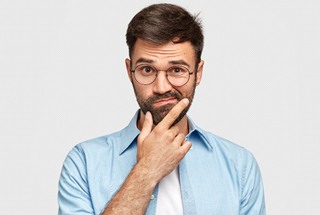 Wondering man with questions about veneers in Boston