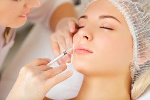 a woman receiving Botox injections