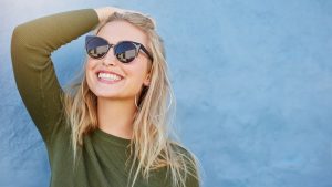 woman in sunglasses smiling