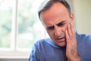 Man experiencing dental pain