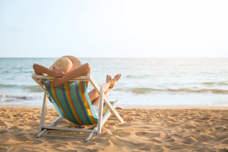 woman relaxing on the beach during summer vacation