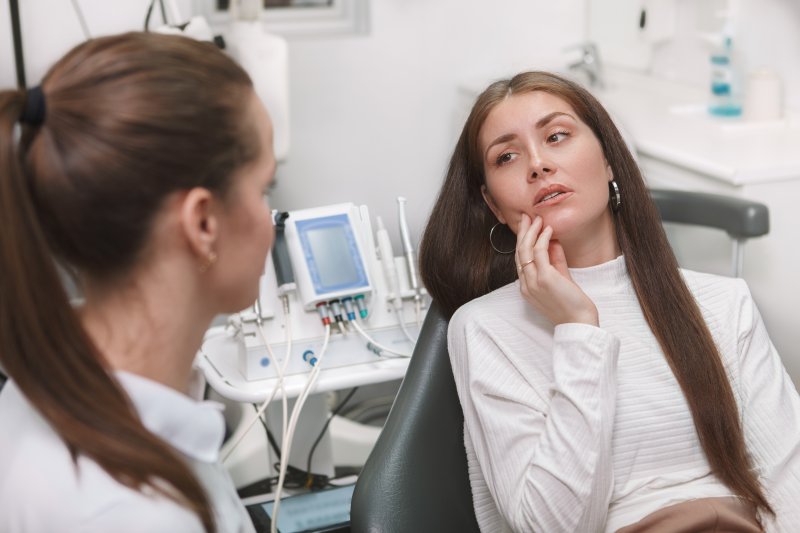 patient learning how to find an emergency dentist in Boston