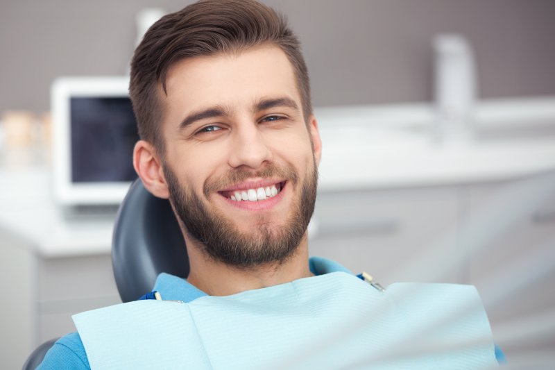 person smiling after having gray teeth fixed