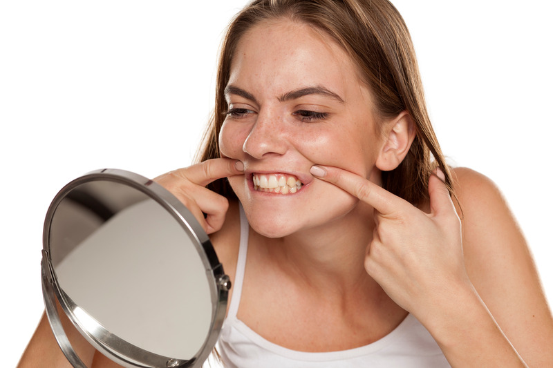 Patient checking their smile after teeth whitening