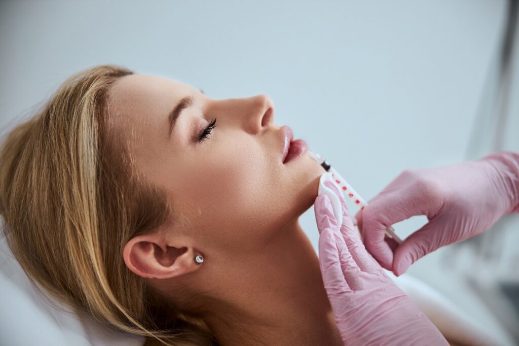 A woman receiving dermal fillers
